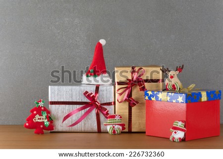 gift box and christmas hat on wood table