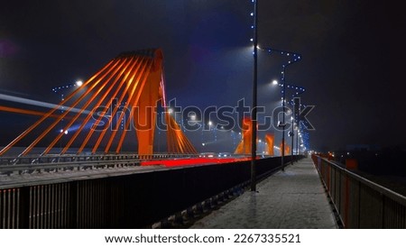 south bridge in riga at night.