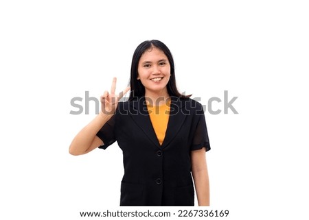 Young asian business woman smiling while showing two fingers. Isolated on white background