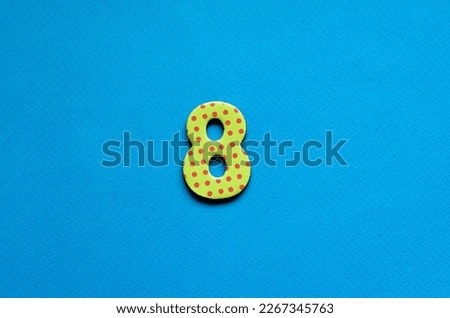 number eight on blue paper background