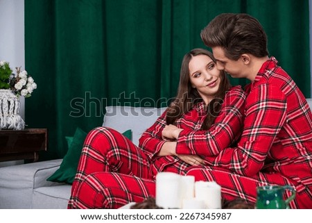 Smiling girl looks straight into her boyfriend's eyes