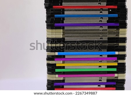 pile of floppy disks used in the 80s and 90s to record data from personal computers