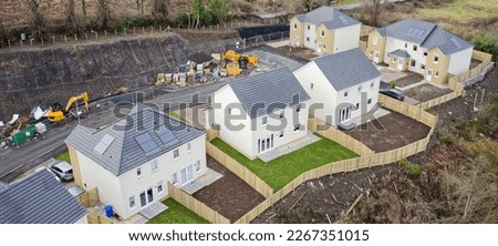 New housing development building houses for increased demand in rural areas Royalty-Free Stock Photo #2267351015