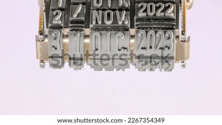 Rubber stamp that reads December 31 2023 on a light background