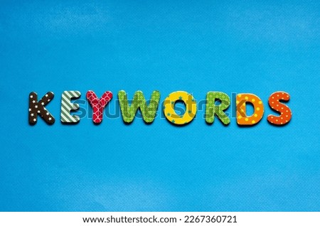 word keywords on blue paper background