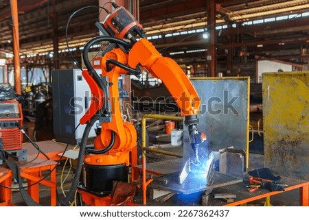 Robotic Welding Machine, Welding a Steel Plate of Steel Structure with Robotic Welding or Robotic Arm Welding at Industrial Factory. Royalty-Free Stock Photo #2267362437