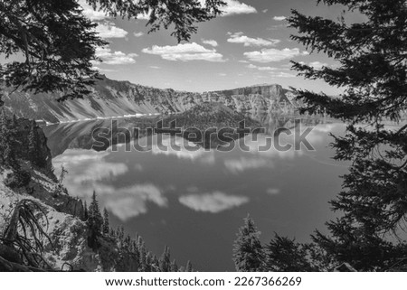 Crater Lake Oregon and Wizard Island pictured through the trees