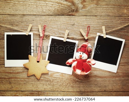 Vintage photo frames decorated for Christmas on the wooden board background with space for your text