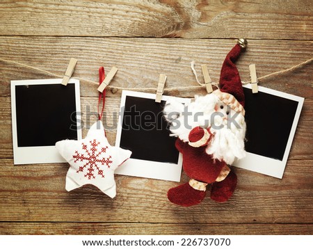 Vintage photo frames decorated for Christmas on the wooden board background with space for your text