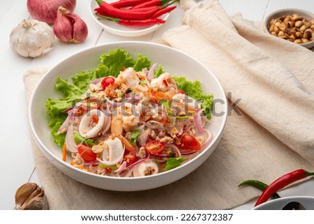 Spicy Glass Noodle Salad,mixed shrimp with minced pork and squid with boiled vermicelli in chili sauce(Yum Woon Sen) Royalty-Free Stock Photo #2267372387