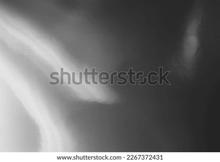 photo flash light on glossy silver foil material creating cool light reflection overlay. background with scratches. Royalty-Free Stock Photo #2267372431