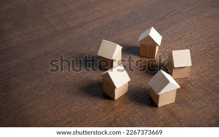 Circle of houses figures. Community of homeowners. Housing and real estate. Residents co-op. Investments and construction. Mortgage. Realtor services. Royalty-Free Stock Photo #2267373669
