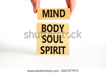 Mind body soul spirit symbol. Concept words Mind Body Soul Spirit on wooden blocks. Beautiful white table white background. Businessman hand. Lifestyle mind body soul spirit concept. Copy space. Royalty-Free Stock Photo #2267377971