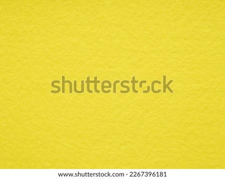 Bright yellow matt felt material blank. Surface of felted fabric texture background. High resolution photo. Pattern for text, lettering, 3d, patchworkor other art work. Full frame backdrop wallpaper.