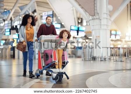 Airport, family and child excited for flight with suitcase trolley on holiday, vacation or immigration journey and travel. Luggage of mother, father or diversity parents with girl kid flying in lobby Royalty-Free Stock Photo #2267402745