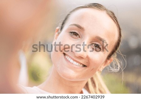 Portrait, selfie and woman in nature for wellness, relax or training, happy and smile on blurred background. Face, girl and runner pose for profile picture, photo or social media update after workout