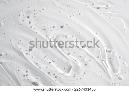 Clear gel serum texture. Liquid skincare cream background. Cosmetic gel product with bubbles close up Royalty-Free Stock Photo #2267431455