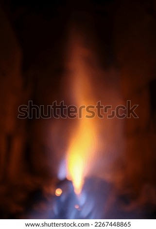 Fire in the oven. Wood fire, hot scene. At night without a light near the fireplace