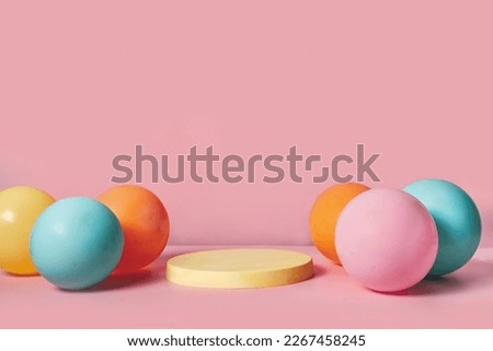 Product podium stage with pastel color balloons on pink backgtound. Abstract background and decoration scene template for Spring and Easter