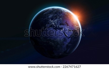 Blue planet Earth at night. Lights in cities. Sunlight at the dawn. Earth in deep dark space. Europe and Africa continent. Elements of this image furnished by NASA