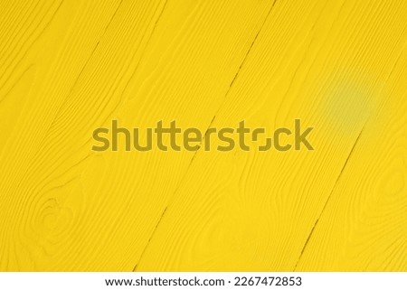 Texture of yellow wooden surface as background, closeup