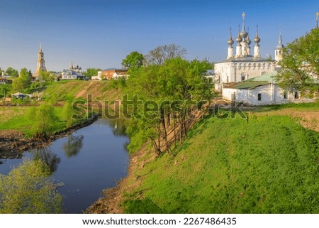 Orthodox church at golden sunrise with river, Suzdal, Russia