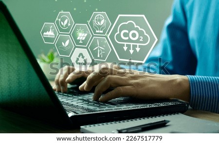 CO2 emission reduction concept, businessman with environmental technology Icons, global warming, sustainable development, renewable energy business. climate change, carbon capture, storage, reuse Royalty-Free Stock Photo #2267517779