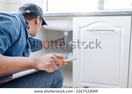Plumber man, technician and clipboard document for pipeline, home renovation and quality assurance notes. Handyman, plumbing service and checklist in house for building, engineering and inspection Royalty-Free Stock Photo #2267533049