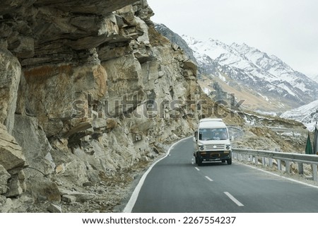 Road trip through Manali Leh Ladak highway in Himalayas India. High altitude road in Kullu Manali Ladakh Himachal Pradesh. Beautiful snow covered Indian mountain Royalty-Free Stock Photo #2267554237