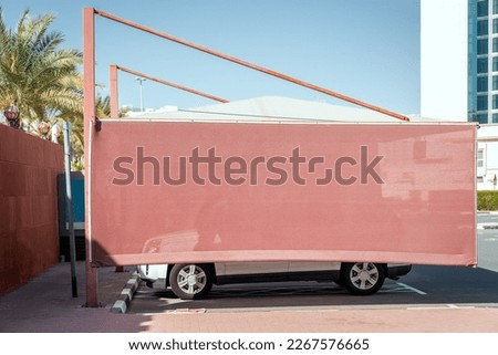 Parking awning for sun protection of cars Royalty-Free Stock Photo #2267576665