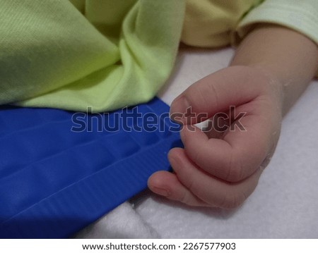 newborn child hand, with smooth skin