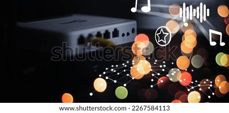 Modern dual band wireless router. Man working in the background. Fast wireless internet concept. Royalty-Free Stock Photo #2267584113