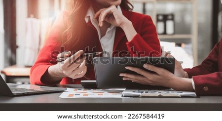 Fund managers team consultation and discuss about analysis Investment stock market by digital tablet Royalty-Free Stock Photo #2267584419
