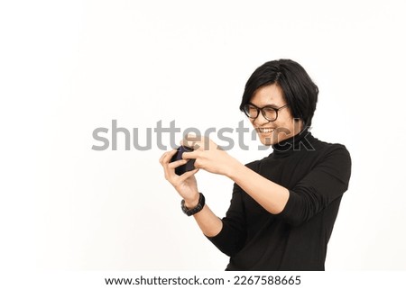 Playing Mobile Game on Smartphone Of Handsome Asian Man Isolated On White Background
