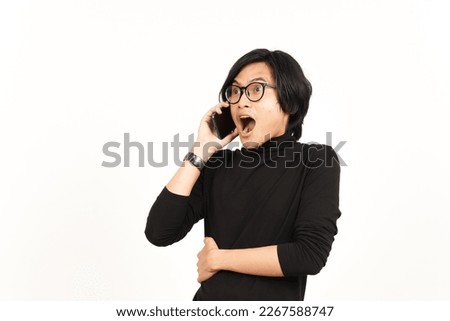 Make a Phone Call Using smartphone with shocked face Of Handsome Asian Man Isolated On White Background