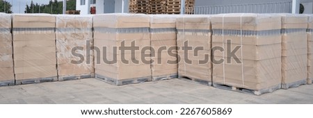Rows of boxes and pallets in warehouse and production warehouse