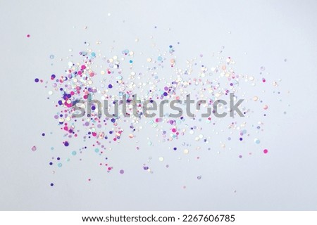 Pink, purple confetti glitter glitter scattered on a white background Royalty-Free Stock Photo #2267606785