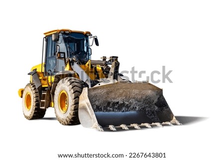 A large front loader or bulldozer a construction site. Transportation of bulk materials. Rental of construction equipment. Isolated loader on a white background Royalty-Free Stock Photo #2267643801
