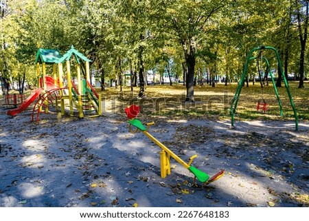 Photography on theme empty playground equipment for kids on background natural nature, photo consisting from different metal playground equipment, steel playground equipment in urban area no people