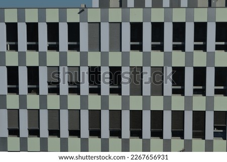 gray building with lots of windows