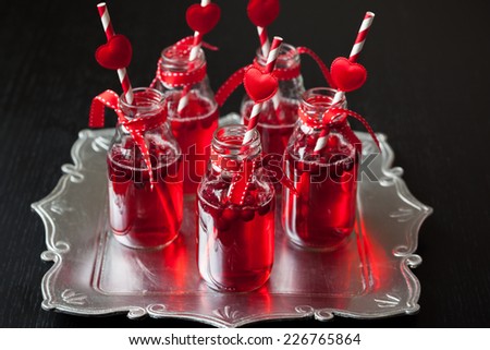 Valentine's Day party idea:individual small bottles with cranberry cocktail