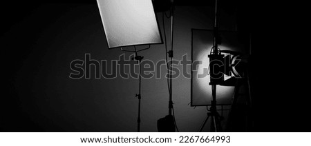 Film light for video production camera in studio set. Use as studio photo shoot lights. Big LED spotlight 5000w and diffuser or black panel create light like sun light can make daytime or golden hour