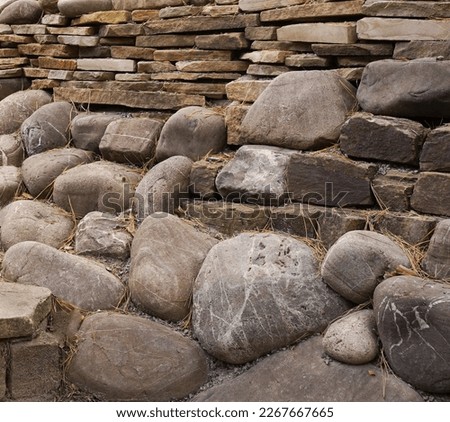 A jumble of different stones slate, boulders, rocks.