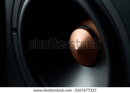 Sound speaker on dark background, close up. Set for listening music. Audio equipment