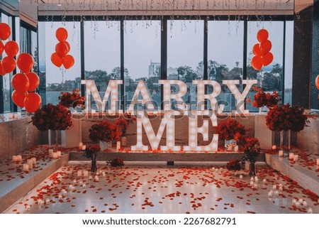 Marry me backdrop proposal engagement event flowers rice balloons candles petals Royalty-Free Stock Photo #2267682791