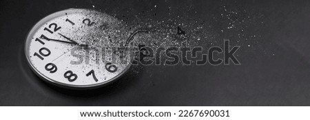 Flow of time. Analog clock dissolving on black background, space for text. Banner design Royalty-Free Stock Photo #2267690031