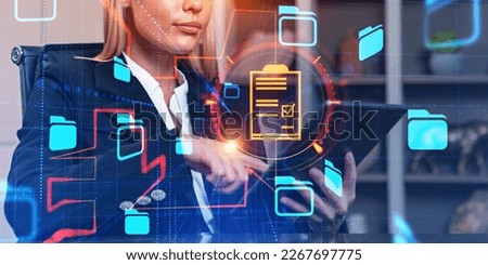 Businesswoman using tablet in hand, double exposure with online database and business files storage. Concept of documents management
