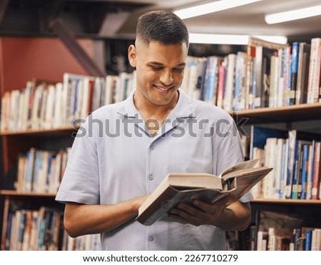 Happy student, reading or library books in education, learning or studying for university, college or school degree. Smile, man or bookstore customer in textbook research for scholarship degree goals