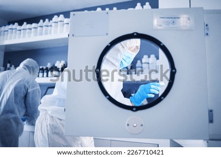 Science incubator, lab safety gear and biotechnology security for a medical research experiment. Virus analysis, pharmaceutical study and vaccine chemical innovation in laboratory with scientist team Royalty-Free Stock Photo #2267710421