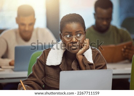 Student stress, anxiety or fear in exam, test or classroom lesson on laptop in university, school or college campus. Black woman, crsis or problem on technology studying or education learning burnout